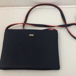 navy blue crossbody bag with orange accent